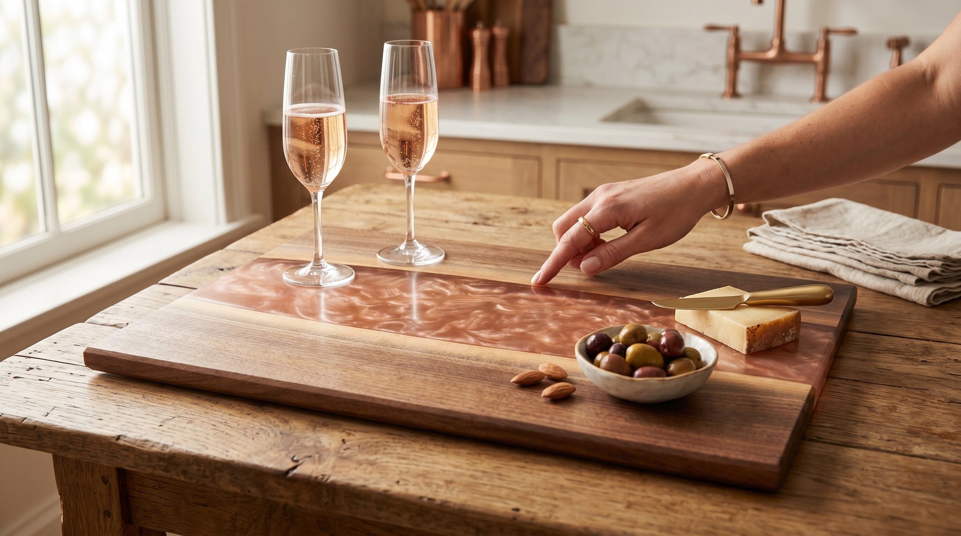 Mesos center-river charcuterie board in rose champagne resin with champagne and charcuterie