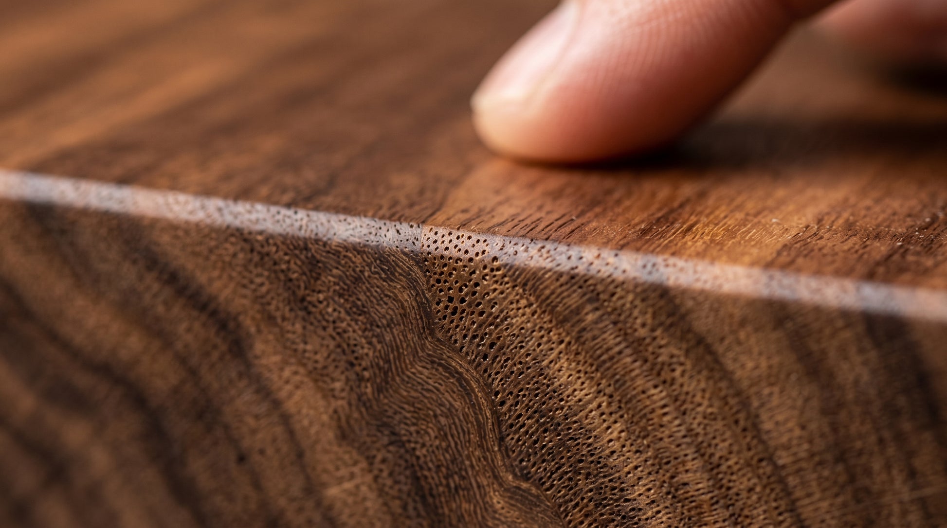 Close-up of the 25-degree chamfer and walnut grain edge