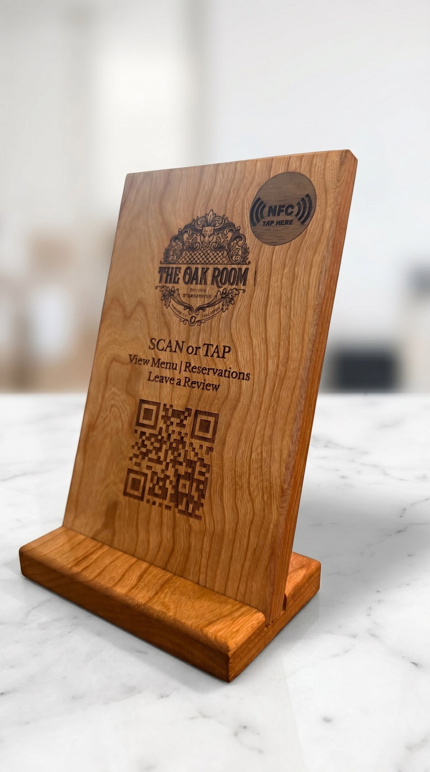 Cherry hardwood countertop NFC sign with custom laser-engraved restaurant logo and QR code on marble counter